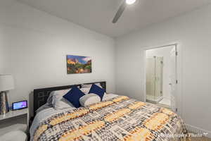 Bedroom with ceiling fan and ensuite bathroom