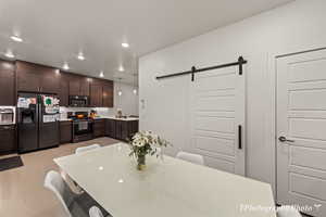 Dining space featuring a barn door