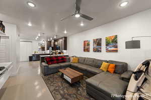 Living room featuring a textured ceiling and ceiling fan