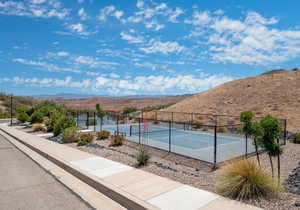 View of tennis court featuring a mountain view