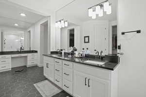 Bathroom featuring vanity and tile patterned floors