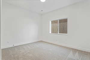 Empty room with carpet flooring