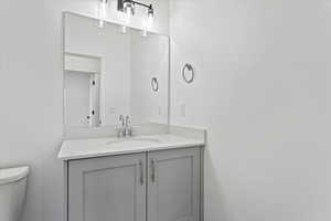 Bathroom with vanity and toilet