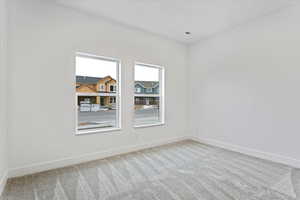 Empty room featuring carpet floors