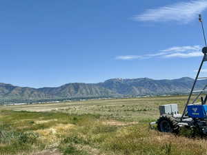 View of mountain backdrop with rural landscape