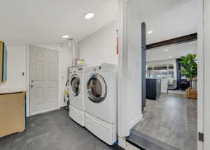 Laundry room with washing machine and dryer included.