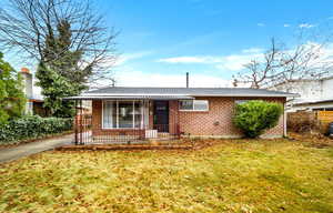 View of front of house with a front lawn