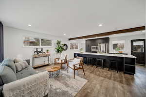 Living room featuring beamed ceiling