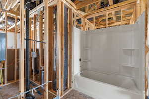 Full bathroom featuring electric panel and shower / bath combination