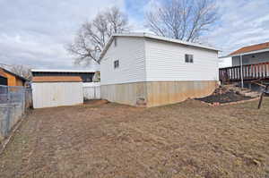 View of yard with a storage shed