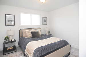 Bedroom with light colored carpet