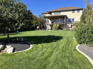 Back of house featuring a lawn