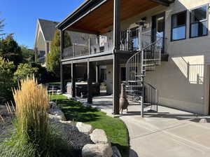 Exterior space featuring a patio area and a hot tub