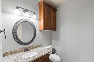 Bathroom with vanity and toilet