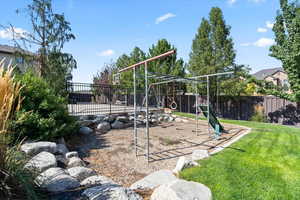 View of play area featuring a lawn