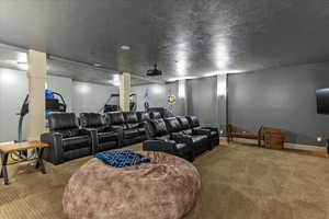 Home theater room with carpet floors