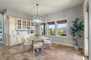 Dining area featuring a mountain view and a notable chandelier