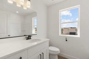 Bathroom featuring vanity and dark wood-style flooring