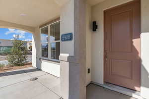 Entrance to property featuring stucco siding