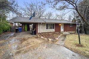 Ranch-style home with a carport