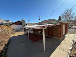 Rear view of property with a garage