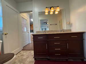 Bathroom with vanity and toilet