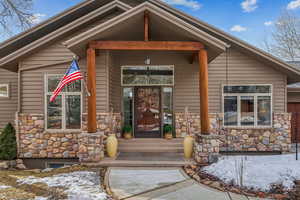 View of snow covered property entrance