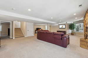 Living room featuring light carpet