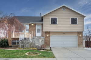 Split level home featuring a garage