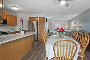 Dining area featuring dark hardwood / wood-style floors and ceiling fan