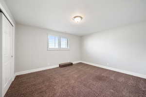 Spare room featuring carpet floors