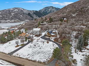 Snowy aerial view featuring a mountain view