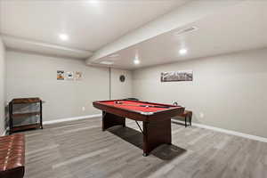 Playroom with billiards and light hardwood / wood-style flooring