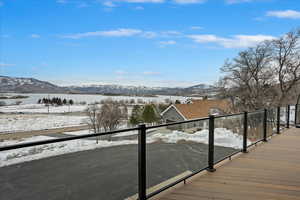 View of dock with a balcony and a mountain view