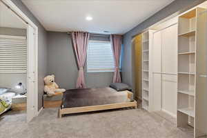 Bedroom featuring carpet flooring