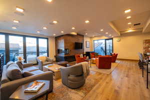 Living room featuring light wood-style floors and recessed lighting