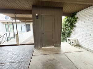 View of exterior entry featuring a patio area