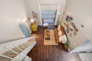 Living room with dark hardwood / wood-style flooring