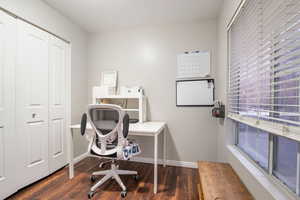 Office space featuring dark hardwood / wood-style flooring