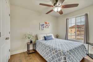 Bedroom featuring hardwood / wood-style flooring and ceiling fan