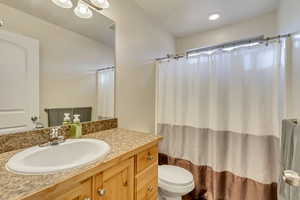 Bathroom featuring vanity and toilet