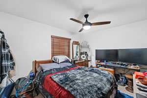 Bedroom with carpet flooring and ceiling fan