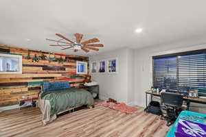 master bedroom with light hardwood / wood-style flooring