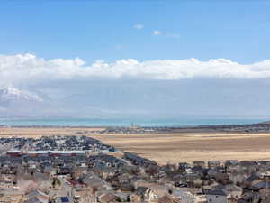 Drone / aerial view featuring a water and mountain view and the LDS temple