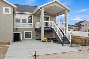 Rear view of house featuring a patio area