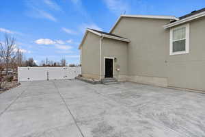 View of side of home featuring a patio area