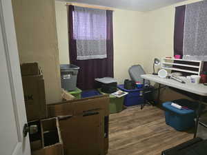 Home office featuring hardwood / wood-style flooring