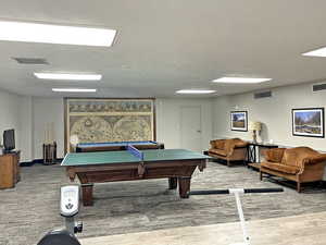 Playroom with hardwood / wood-style floors and pool table