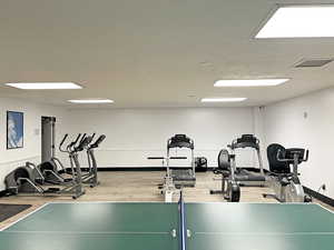 Exercise room with wood-type flooring