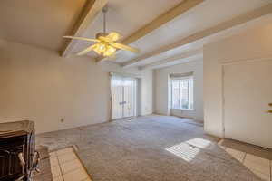 Living room featuring ceiling fan, light colored carpet, and beam ceiling